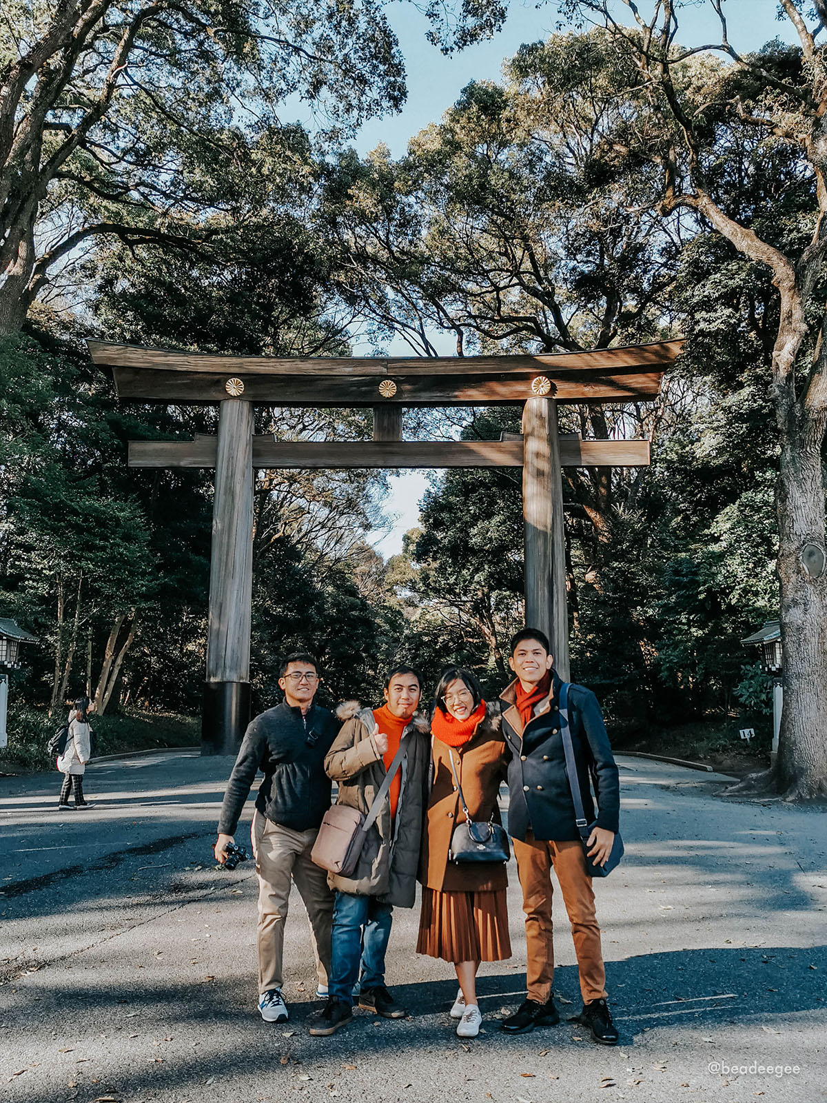4 people in front of meiji shrine